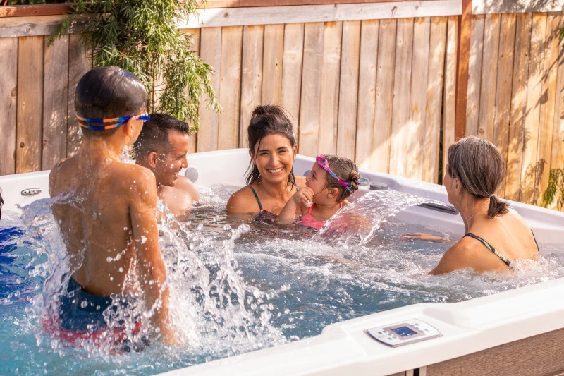 Family with children enjoying a hot tub at home