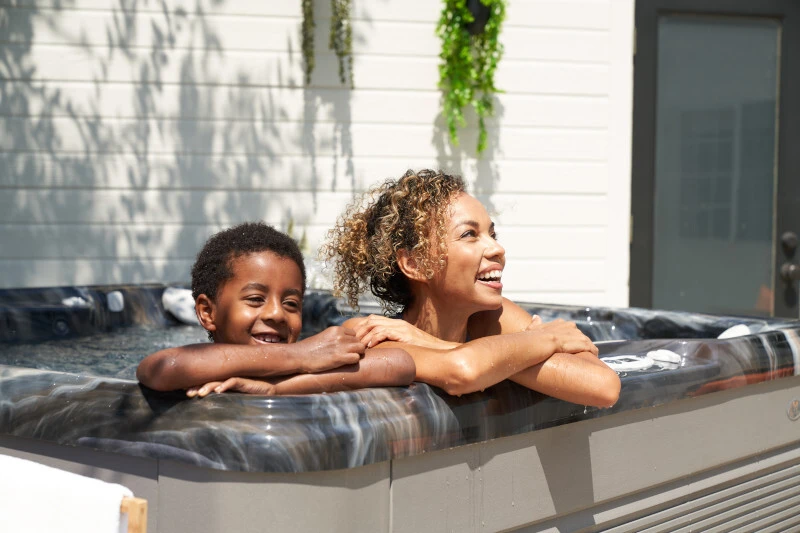 Couple relaxing in an outdoor hot tub